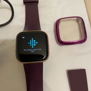 Rose Gold Fitbit Versa 2 with Accessories